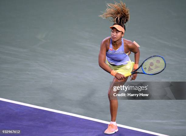 Naomi Osaka of Japan serves in her semifinal victory over Simona Halep of Romania during the BNP Paribas Open at the Indian Wells Tennis Garden on...