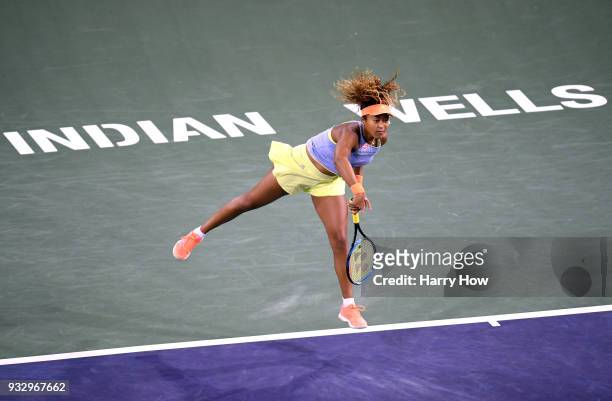 Naomi Osaka of Japan serves in her semifinal victory over Simona Halep of Romania during the BNP Paribas Open at the Indian Wells Tennis Garden on...