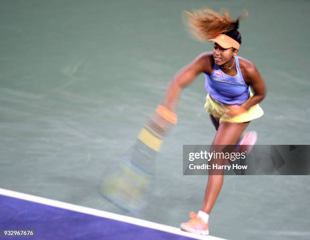 Naomi Osaka of Japan serves in her semifinal victory over Simona Halep of Romania during the BNP Paribas Open at the Indian Wells Tennis Garden on...