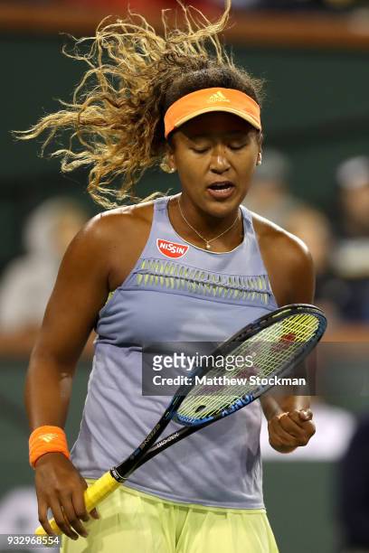 Naomi Osaka of Japan celebrates a point against Simona Halep of Romania during semifinals of the BNP Paribas Open at the Indian Wells Tennis Garden...