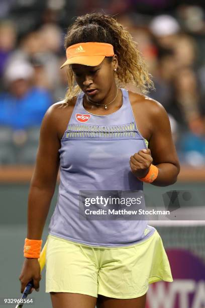 Naomi Osaka of Japan celebrates a point against Simona Halep of Romania during semifinals of the BNP Paribas Open at the Indian Wells Tennis Garden...