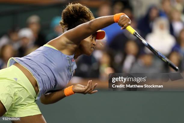 Naomi Osaka of Japan serves to Simona Halep of Romania during semifinals of the BNP Paribas Open at the Indian Wells Tennis Garden on March 16, 2018...