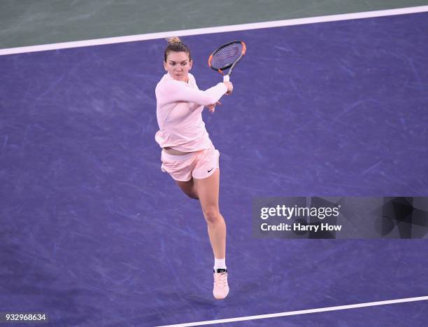 Simona Halep of Romania hits a forehand, losing to Naomi Osaka of Japan in a semifinal during the BNP Paribas Open at the Indian Wells Tennis Garden...