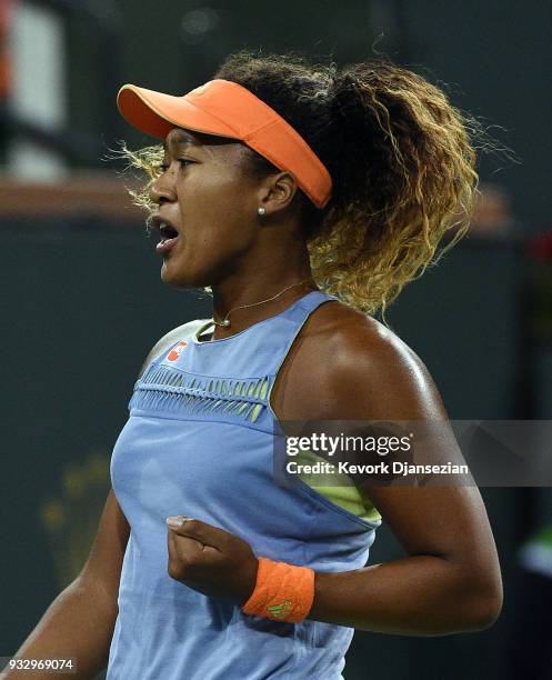 Naomi Osaka of Japan reacts after winning a game against Simona Halep of Romania during their semifinals match during Day 12 of BNP Paribas Open on...