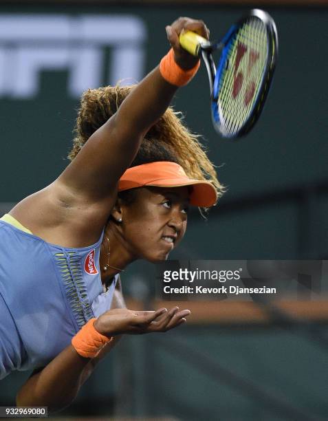 Naomi Osaka of Japan serves against Simona Halep of Romania during their semifinals match during Day 12 of BNP Paribas Open on March 16, 2018 in...