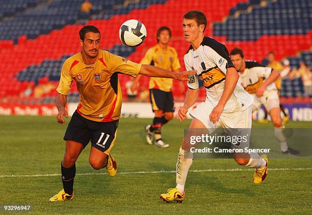 Tarek Elrich of the Jets contests the ball with Tony Lockhead of the Phoenix during the round 15 A-League match between the Newcastle Jets and the...