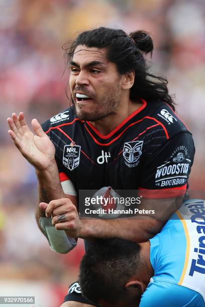 Tohu Harris of the Warriors is tackled by Michael Gordon of the Titans during the round two NRL match between the New Zealand Warriors and the Gold...