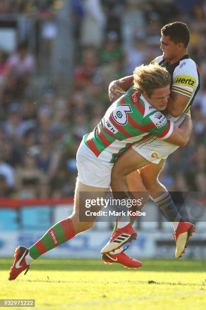 George Burgess of the Rabbitohs tackles Nathan Cleary of the Panthers after a kick during the round two NRL match between the Penrith Panthers and...