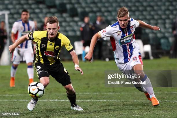 Scott Galloway of the Wellington Phoenix is marked by Riley McGree of the Newcastle Jets during the round 23 A-League match between the Wellington...