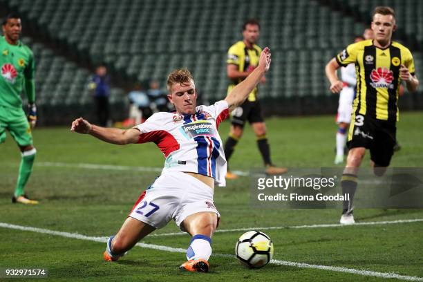 Riley McGree of the Newcastle Jets slides for the ball during the round 23 A-League match between the Wellington Phoenix and the Newcastle Jets at...