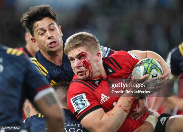 Jack Goodhue of the Crusaders is bloodied during the round five Super Rugby match between the Highlanders and the Crusaders at Forsyth Barr Stadium...