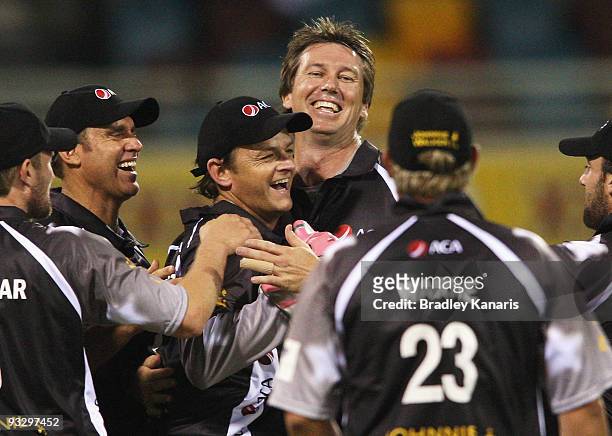 Glenn McGrath of the ACA All*Stars celebrates with team mates after taking the wicket of David Warner of Australia during the Twenty20 exhibition...