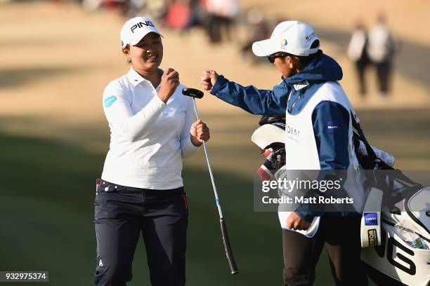 Ai Suzuki of Japan celebrates with her caddie on the 18th green during the second round of the T-Point Ladies Golf Tournament at the Ibaraki Kokusai...