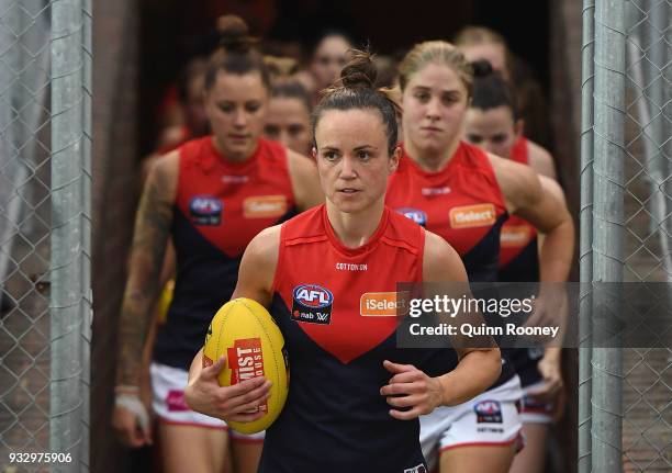 Daisy Pearce of Melbourne leads her team out onto the field during the round seven AFLW match between the Western Bulldogs and the Melbourne Demons...