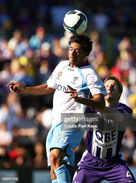 Alex Brosque of Sydney heads the ball in front of Andy Todd of the Glory during the round 15 A-League match between Perth Glory and Sydney FC at ME...