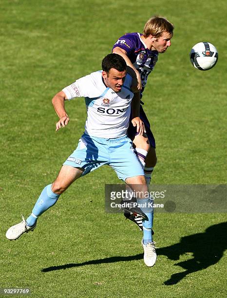 Andy Todd of the Glory and Mark Bridge of Sydney contest the ball during the round 15 A-League match between Perth Glory and Sydney FC at ME Bank...