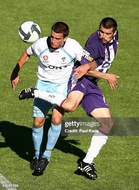 Branko Jelic of the Glory and Stuart Musialik of Sydney contest the ball during the round 15 A-League match between Perth Glory and Sydney FC at ME...