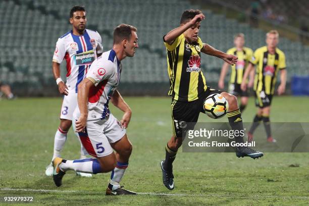 Sarpreet Singh of the Wellington Phoenix is defended by Benjamin Kantarovski of the Newcastle Jets during the round 23 A-League match between the...