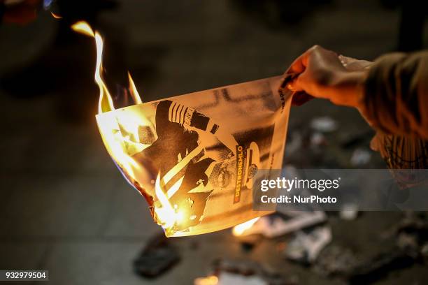 Catalonia's pro-independence activists burn photos of the King of Spain Juan Carlos I and copies of the Spanish Constitution in the neighborhood of...