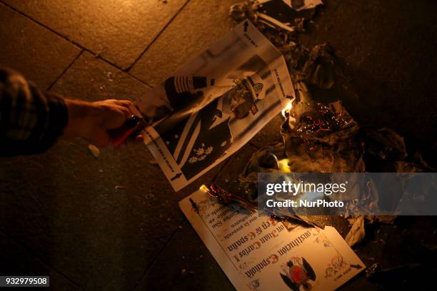 Catalonia's pro-independence activists burn photos of the King of Spain Juan Carlos I and copies of the Spanish Constitution in the neighborhood of...