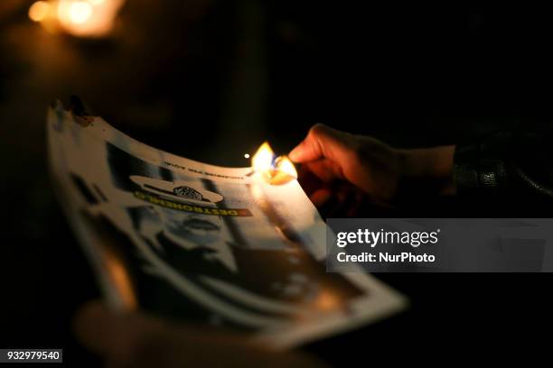 Catalonia's pro-independence activists burn photos of the King of Spain Juan Carlos I and copies of the Spanish Constitution in the neighborhood of...