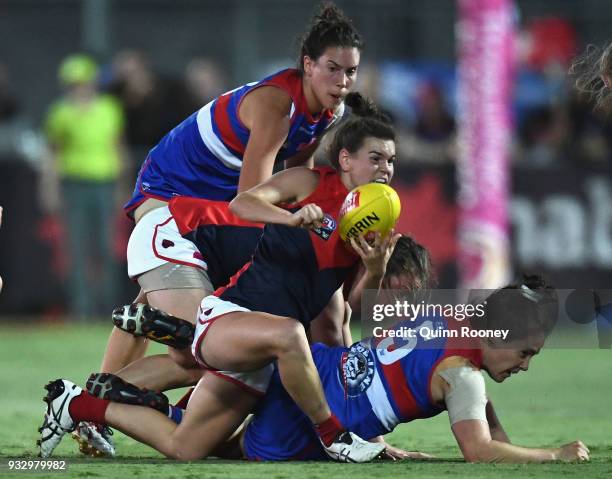 Lily Mithen of the Demons handballs during the round seven AFLW match between the Western Bulldogs and the Melbourne Demons at Whitten Oval on March...