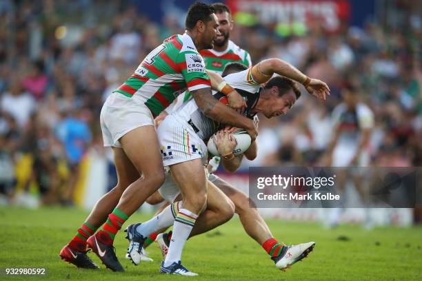 James Maloney of the Panthers is tackled during the round two NRL match between the Penrith Panthers and the South Sydney Rabbitohs at Penrith...