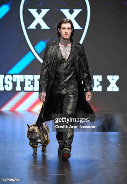 Model Jimmy Q and dog walk the runway wearing Mister Triple X at Los Angeles Fashion Week Powered by Art Hearts Fashion LAFW FW/18 10th Season...