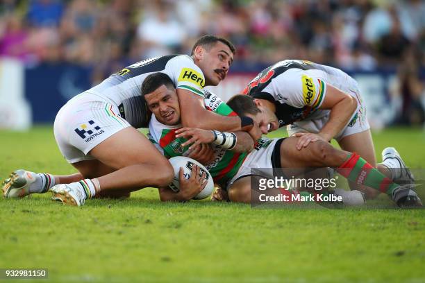 Cody Walker of the Rabbitohs is tackled during the round two NRL match between the Penrith Panthers and the South Sydney Rabbitohs at Penrith Stadium...