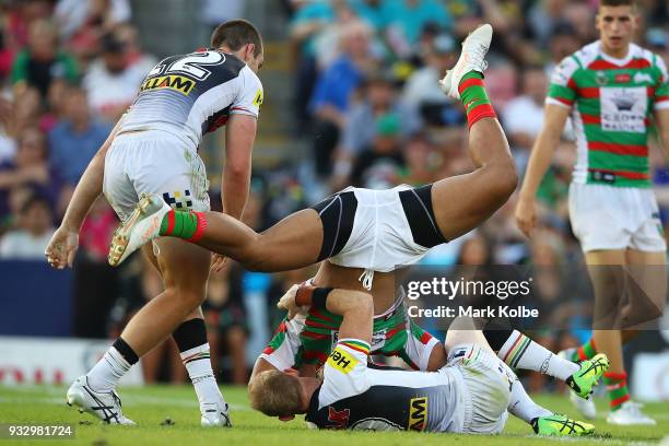 Robert Jennings of the Rabbitohs is tackled during the round two NRL match between the Penrith Panthers and the South Sydney Rabbitohs at Penrith...