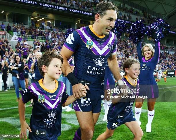 Billy Slater walks out with hisÊÊtwo children, daughter Tyla Rose and son Jake for this 300th match during the round two NRL match between the...