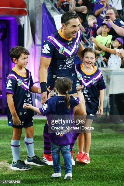 Billy Slater walks out with hisÊÊtwo children, daughter Tyla Rose and son Jake for this 300th match during the round two NRL match between the...