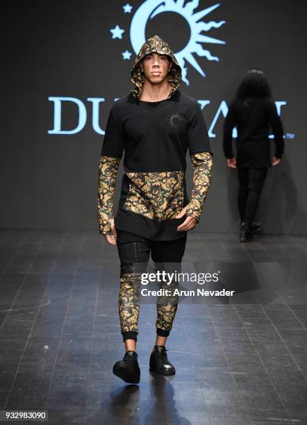 Model walks the runway wearing Dunyah at Los Angeles Fashion Week Powered by Art Hearts Fashion LAFW FW/18 10th Season Anniversary at The MacArthur...