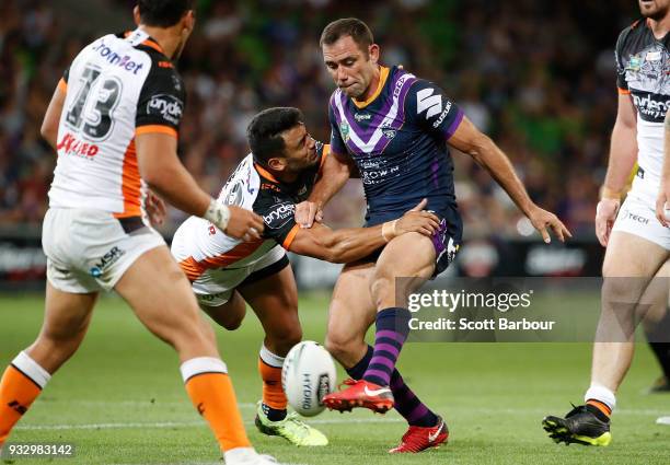 Cameron Smith of the Melbourne Storm kicks the ball during the round two NRL match between the Melbourne Storm and the Wests Tigers at AAMI Park on...