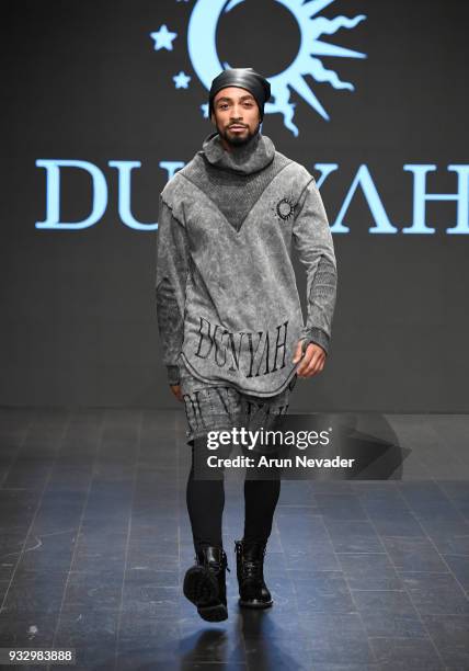 Model walks the runway wearing Dunyah at Los Angeles Fashion Week Powered by Art Hearts Fashion LAFW FW/18 10th Season Anniversary at The MacArthur...