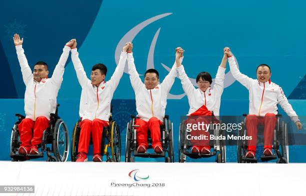Wang Haitao, Chen Jianxin, Liu Wei, Wang Meng and Zhang Qiang celebrate the golden medal after the Curling Mixed Golden Medal match between China and...