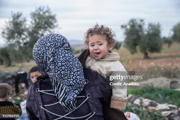 Woman and a kid, who are forced and brought to Afrin to be used as human shields by PKK/KCK/PYD-YPG and Daesh terror groups, are seen as they return...