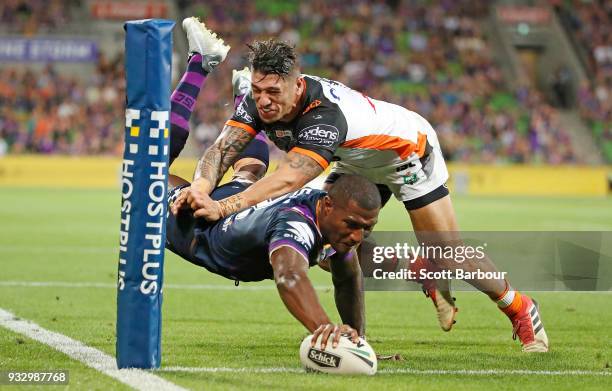 Suliasi Vunivalu of the Melbourne Storm dives to score a try during the round two NRL match between the Melbourne Storm and the Wests Tigers at AAMI...