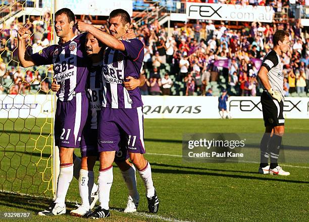 Mile Sterjovski, Adriano Pellegrino and Branko Jelic of the Glory celebrate a goal as Clint Bolton of Sydney looks on during the round 15 A-League...