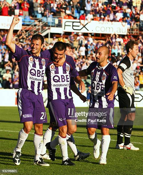 Mile Sterjovski, Branko Jelic and Adriano Pellegrino of the Glory celebrate a goal as Clint Bolton of Sydney looks on during the round 15 A-League...