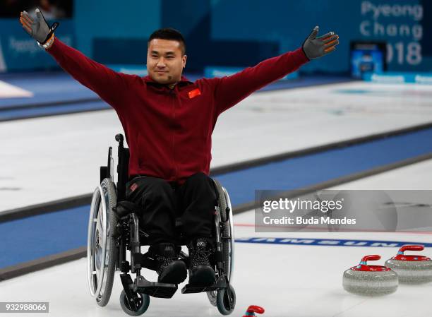 Wang Haitao of China celebrates the golden medal after defeating Norway in the Curling Mixed Golden Medal match between China and Norway during day...