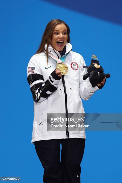 Gold Medallist Oksana Masters of the United States celebrates at the medal ceremony for the Cross Country Women's 5km - Sitting on day eight of the...