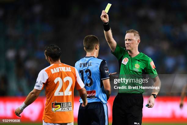 Eric Bautheac of Brisbane receives a yellow card during the round 23 A-League match between Sydney FC and the Brisbane Roar at Allianz Stadium on...