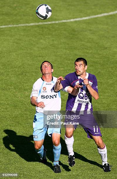 Branko Jelic of the Glory and Stuart Musialik of Sydney contest the ball during the round 15 A-League match between Perth Glory and Sydney FC at ME...