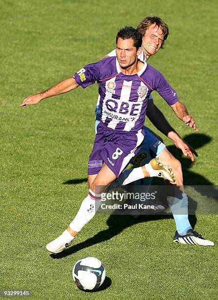 Victor Sikora of the Glory and Stephen Keller of Sydney contest the ball during the round 15 A-League match between Perth Glory and Sydney FC at ME...