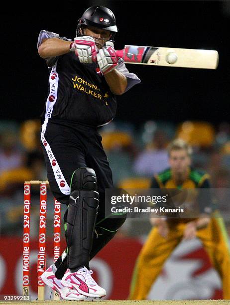 Adam Gilchrist of the ACA All*Stars plays a hook shot during the Twenty20 exhibition match between Australia and the ACA All*Stars at The Gabba on...