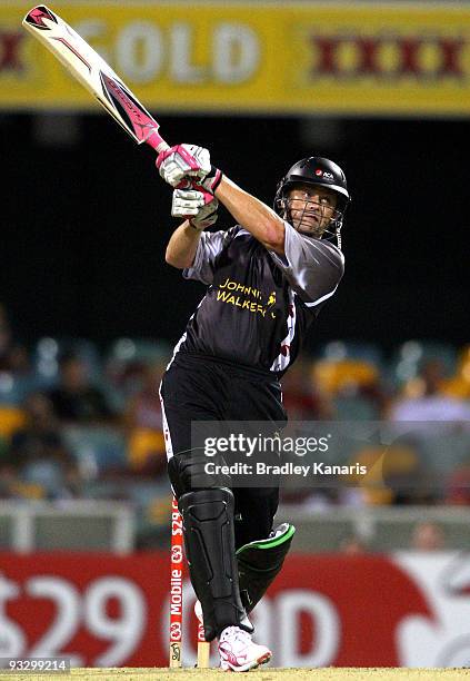 Adam Gilchrist of the ACA All*Stars drives the ball into the air during the Twenty20 exhibition match between Australia and the ACA All*Stars at The...