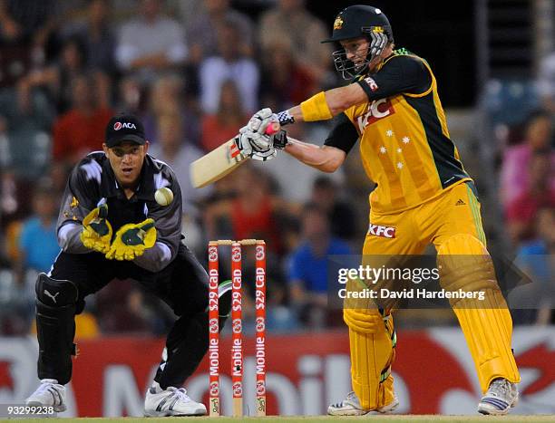 George Bailey of Australia hits the ball for a six during the Twenty20 exhibition match between Australia and the ACA All*Stars at The Gabba on...