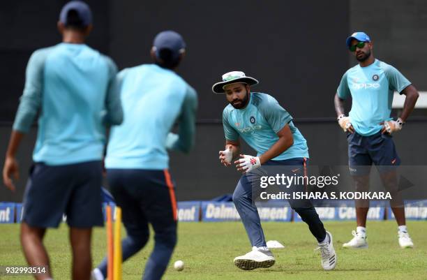 Indian cricket captain Rohit Sharma takes part in a practice session at the R.Premadasa Stadium in Colombo on March 17, 2018. India is playing the...