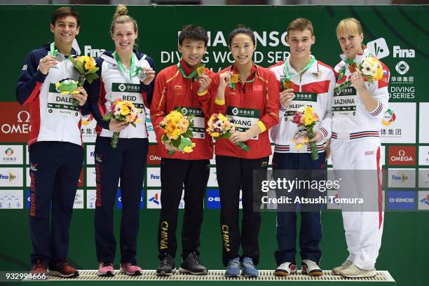 Grace Reid and Thomas Daley of Great Britain , Han Wang and Zheng Li of China , Nadezhda Bazhina and Nikita Shleikher of Russia pose on the podium...